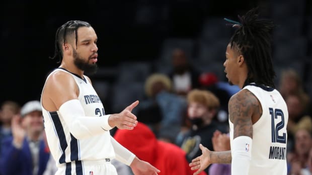 Nov 10, 2021; Memphis, Tennessee, USA; Memphis Grizzles guard Dillon Brooks (left) and Memphis Grizzles guard Ja Morant (right) high five after a basket during the first half at FedExForum. Mandatory Credit: Petre Thomas-USA TODAY Sports